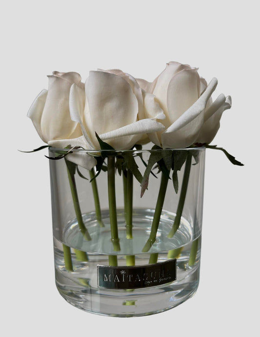 Rose buds in glass vase